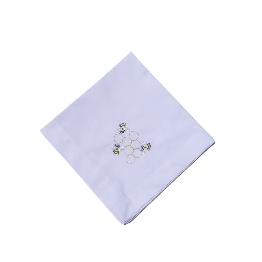 Serviette blanche avec broderie abeille